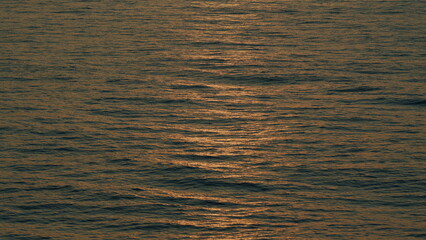 Ocean Waves And Their Reflection On Sunset. Sunset In Seaside. Sunrise In Sea. Relaxation Concept.