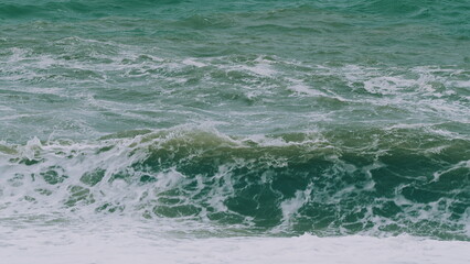 Sea Ocean Water Big Surf Wave Splash Beach. Sea Water Splashing. Large Ripples That Wash Against...