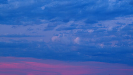 Beautiful Flying blue and Pink Clouds. Romantic colorful sunset. Evening Colorful Delightful Clouds. Timelapse.