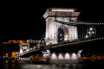 The historic Chain Bridge illuminated at night in Budapest	