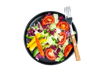 Vegetable vegan salad for weight loss on a black plate isolated on white