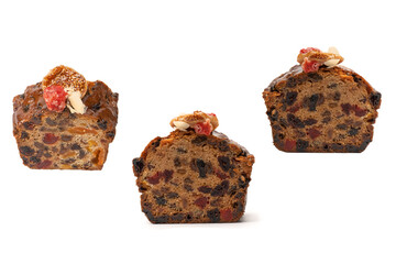 A cake with dried fruits, raisins almonds, dried strawberry.
