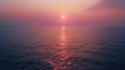 Obraz premium A realistic photograph of the beautiful red sunset over the blue sea on the twilight time