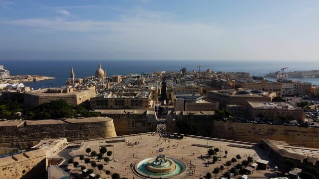 Aerial drone view of Valletta - capital of Malta island Europe, Mediterranean sea main church, dome, view of the Triton Fountain in the city center