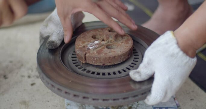 Remove the wheel hub from the brake rotor to replace the brake rotor.Car maintenance.Car repair service.