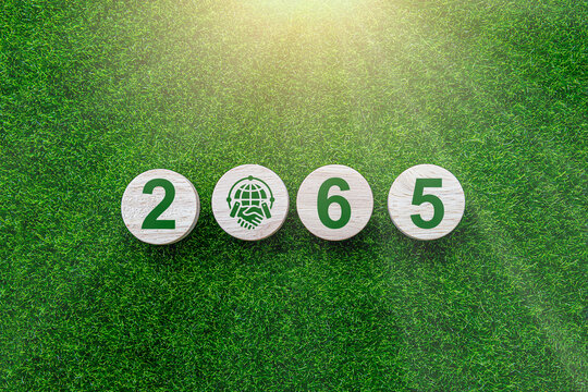 Carbon Credit Market. Carbon credit icon in hand on green leaf background. Icon energy and environmental protection round green energy neutral carbon Net zero greenhouse gas emissions target in 2065