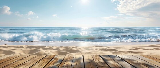 Wooden planks on a sandy beach with blue ocean and sky.