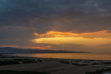 Beautiful bright orange - yellow cloudy sky during the sunrise and sunset. 1