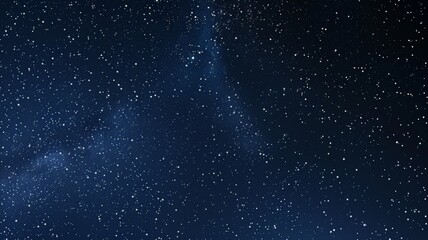 The Milky Way is prominently visible amidst a sea of stars, creating a breathtaking celestial display. The deep blue sky adds to the mystique of the night.