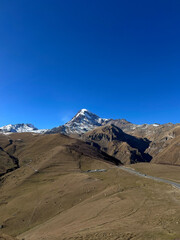 Georgia, Kazbegi region. View of the green peaks of the mountains 