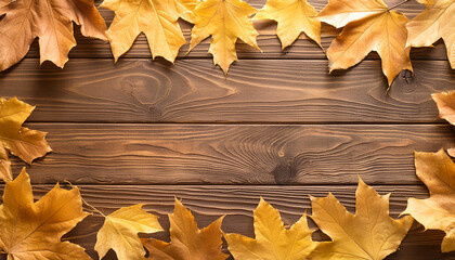 Obraz premium Fallen colorful leaves on wooden table. Autumn season. Beautiful nature. Seasonal decoration. Top view.