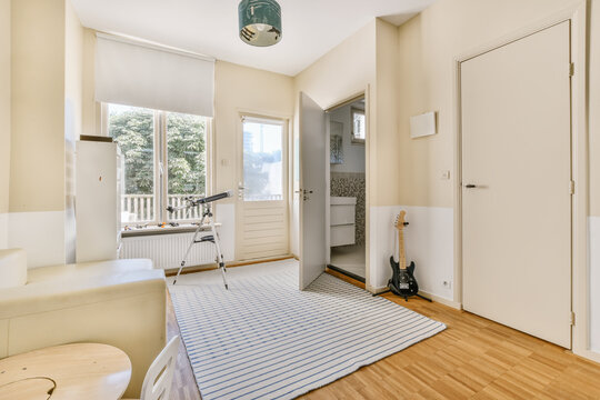Bright and airy modern interior design, with guitar and telescope