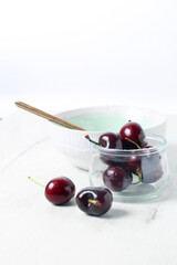 Still life with cherries isolated on white background
