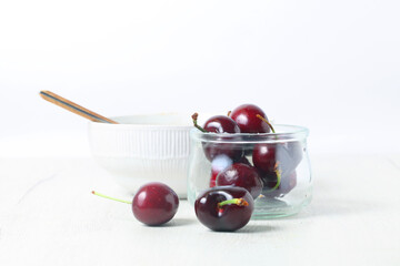 Still life with cherries isolated on white background
