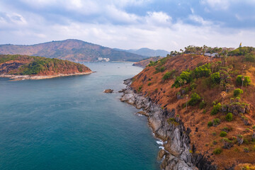 Fototapeta premium Viewpoint Promthep Cape of Phuket, Amazing aerial view sunset above Nai Harn beach, Thailand travel