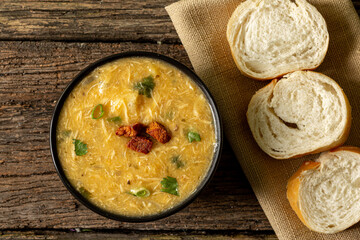 Caldo de Kenga Cassava broth with shredded chicken, typical Brazilian food known as (Caldo de...