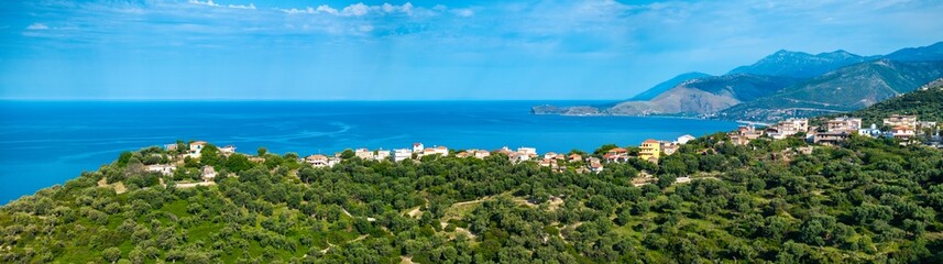 Obraz premium Panoramic image of Piqeras, a small village in the Albanian Riviera showing the beautiful landscape and Ionian sea. 