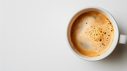 Fototapeta premium Cup of coffee with frothy milk on a white background. Flat lay composition with copy space for drink and breakfast designs