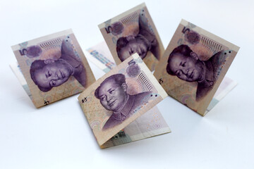 Chinese money, Yuan banknotes on blue background.