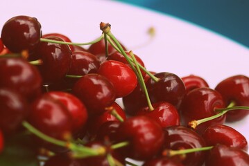 Cherries on a plate, close-up, toned