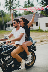 Obraz premium young couple in love, riding a motorcycle, hug, passion, free spirit, american flag