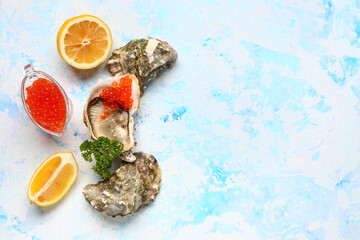 Tasty oysters with lemon and red caviar on blue background