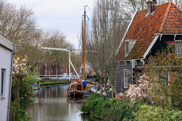 A sailing boat in a canal in the Dutch town of Edam