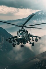 Fototapeta premium Military Helicopter Over Mountain Range