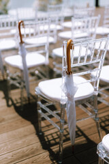 white wooden chairs for wedding ceremony