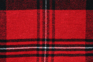 Closeup view of red plaid fabric texture as background