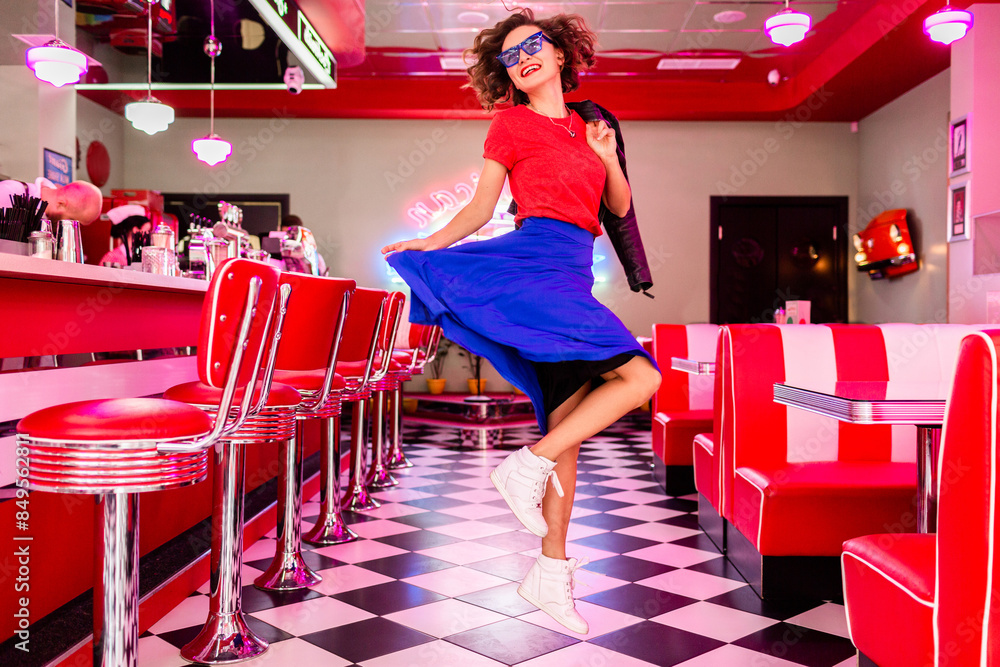 Wall mural stylish smiling woman in retro vintage cafe