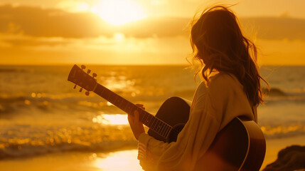 young woman holding a guitar on sunset beach
