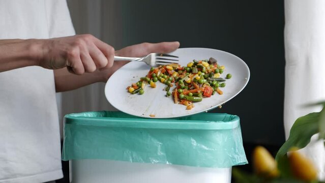 Recycling Food Waste at Home. Composting of organic waste. Leftovers are sorted and thrown into the compost bucket. A sustainable cycle