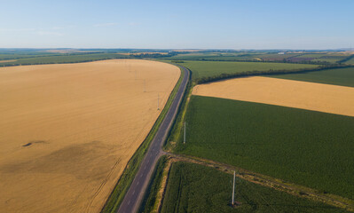 Rural aerial landscape with multicolor agriculture fields. Farm landscape, agricultural fields.