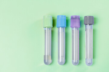 medical syringe and a bottle of injectable medication in a pharmaceutical laboratory green background copy space