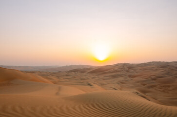 Sunset in the desert of Abu Dhabi in Emirates