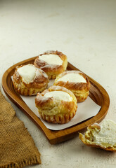 eclairs with vla or custard filling served on a plate