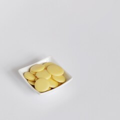 Cacao Butter Drops Isolated on White