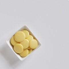 Cacao Butter Drops Isolated on White