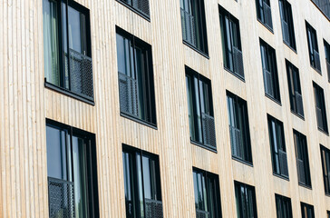 Wooden exterior and windows of a Norwegian hotel during summer.
