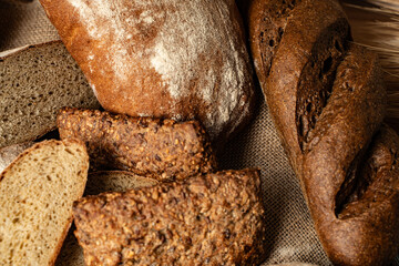 Homemade sourdough bread of different honeycombs on canvas fabric.