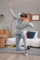 Female student using VR glasses in bedroom