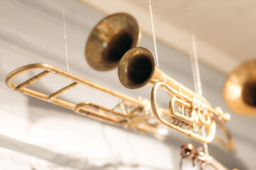 A trumpet hanging from wires in the ceiling found in Norwegian museum.