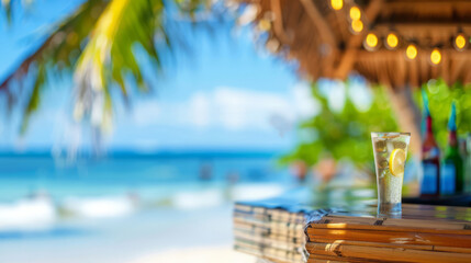 Obraz premium Refreshing Lemon Drink on a Tropical Beach Bar with Ocean View. Perfect for Summer Vacation and Beverage Advertising.