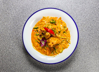fried king shrimp curry with cucumber and coriander served in plate isolated on grey background top view of hong kong fastfood