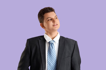 Teenage businessman on lilac background