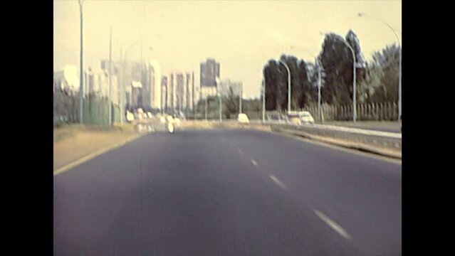 DURBAN, South Africa - circa 1981: street view with vintage cars on the Durban highway in city traffic. Historical archival footage in Durban city of 1980s in South Africa.