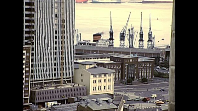 DURBAN, South Africa - circa 1981: aerial view on the Port of Durban with cargo ships and city streets traffic. Historical archival footage in Durban harbor of the 1980s in South Africa.