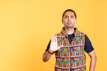 Stern man doing stop hand gesture sign, complaining, giving warning. Authoritative person doing...