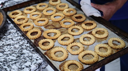 Traditional Moroccan Kaak Biscuits in Various Stages of Preparation